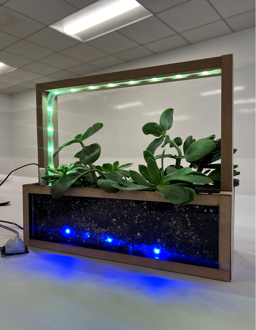 Final build with green frame light and lit soil